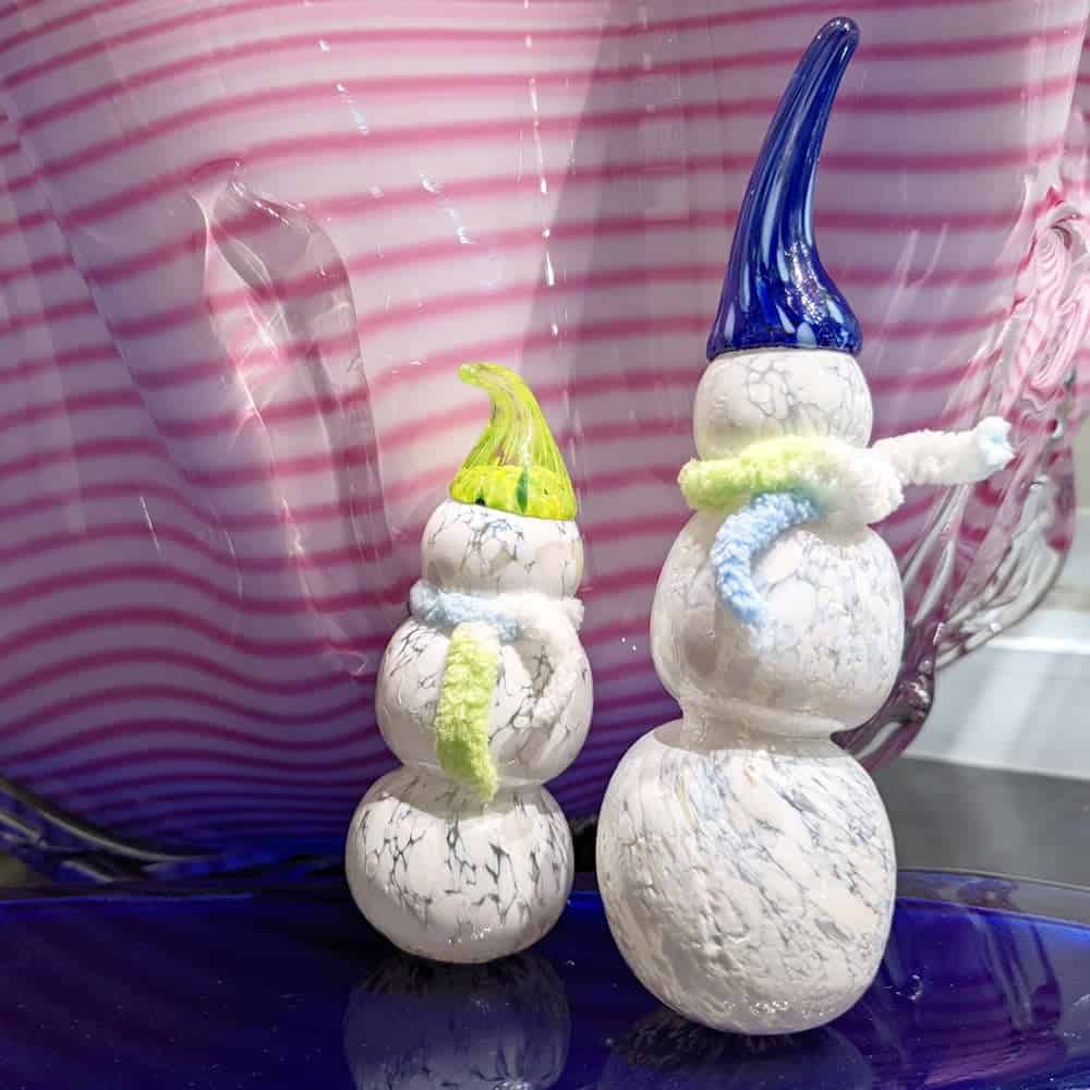 2 glass snowmen on blue